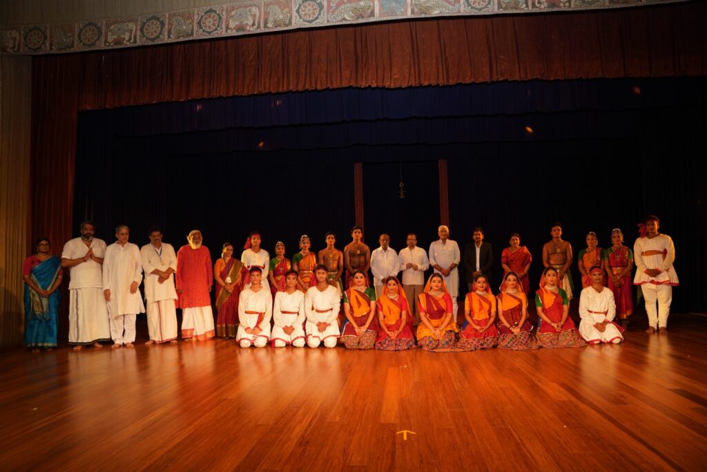 A group of dancers, after performing Dandiya Raas, a folk dance from gujaratar (State of India). The performers and musitians stand together taking the photo along with the ministers on the stage of Kalakshetra foundation Chennai, India.