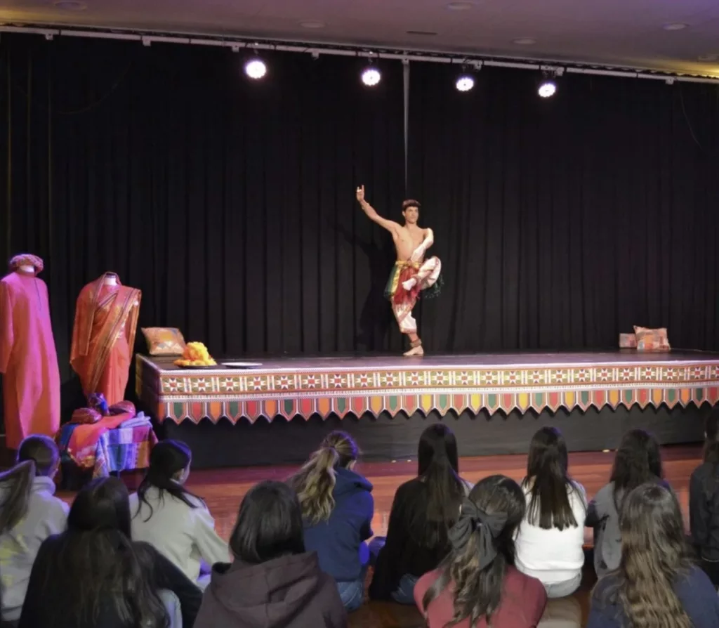 Francisco Valiente on the stage in front of High School Students participating in the Educational programme at Casa de la India Valladolid that serves as a indian cultural immersion for young generations.