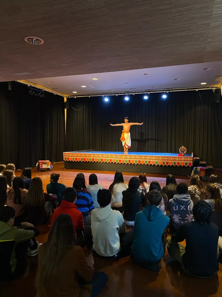 Francisco Valiente on the stage in front of High School Students participating in the Educational programme at Casa de la India Valladolid that serves as a indian cultural immersion for young generations.